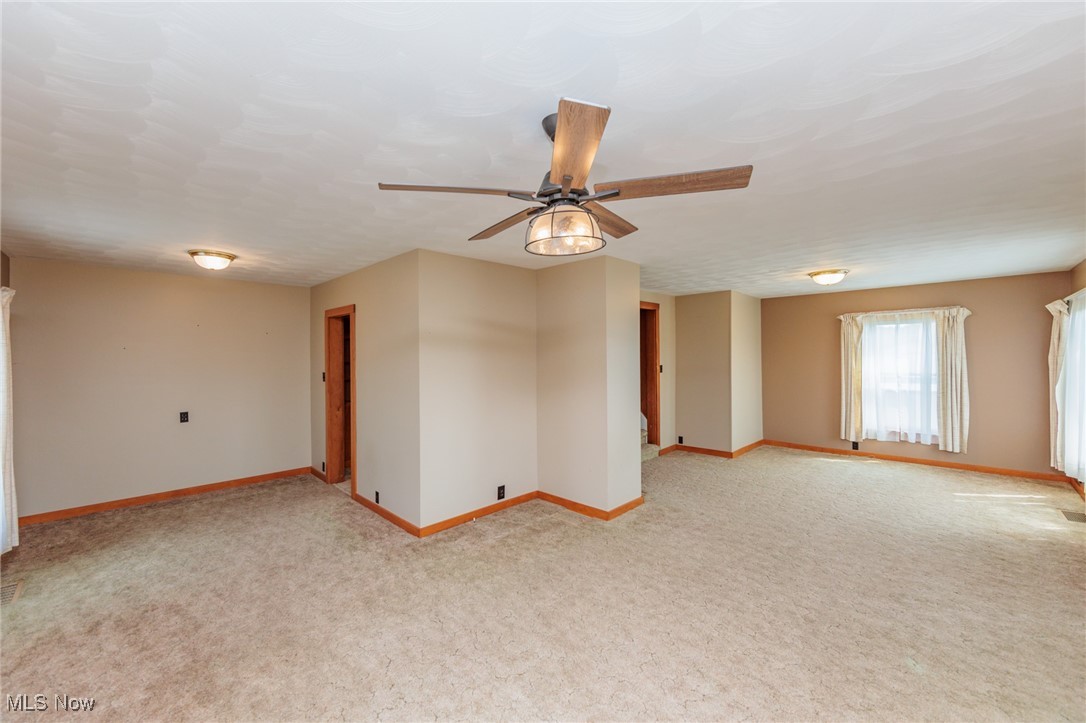 1866 Alpha Road Greenwich, OH 44837 - Photo 18 of 50 Empty room featuring ceiling fan and light colored carpet