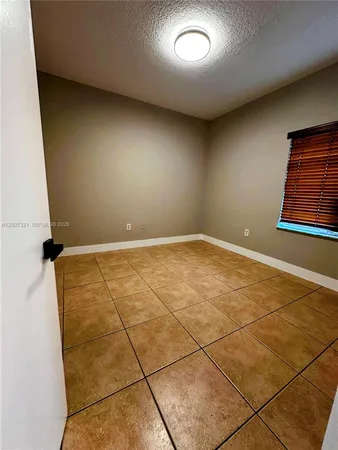 an empty room with a bathtub