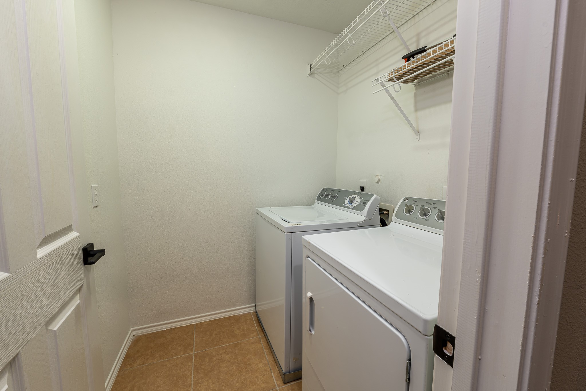 13600 Breton Ridge Street, Unit 35C Houston, TX 77070 - Photo 29 of 35 a utility room with dryer and washer