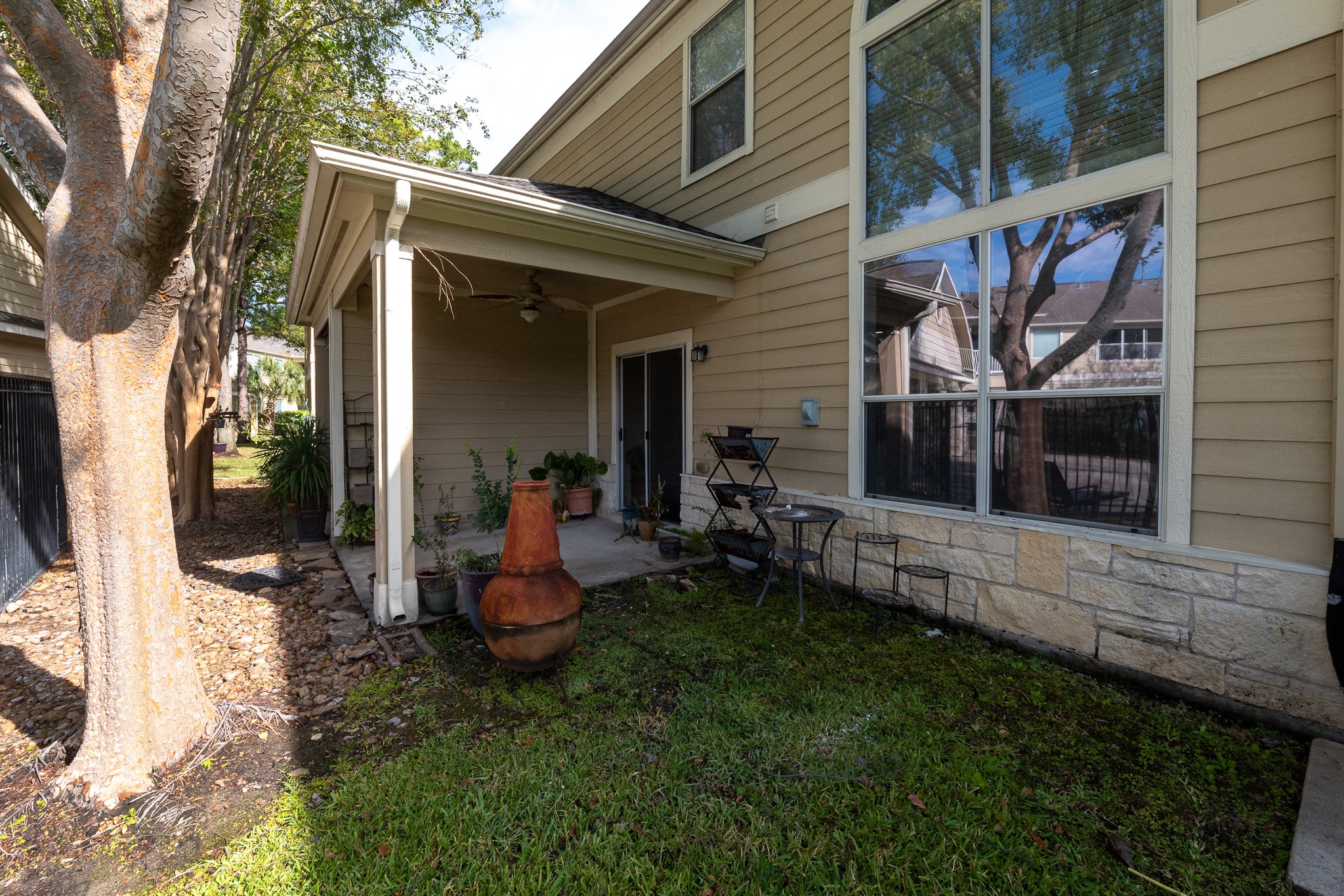 13600 Breton Ridge Street, Unit 35C Houston, TX 77070 - Photo 31 of 35 a front view of a house with a yard