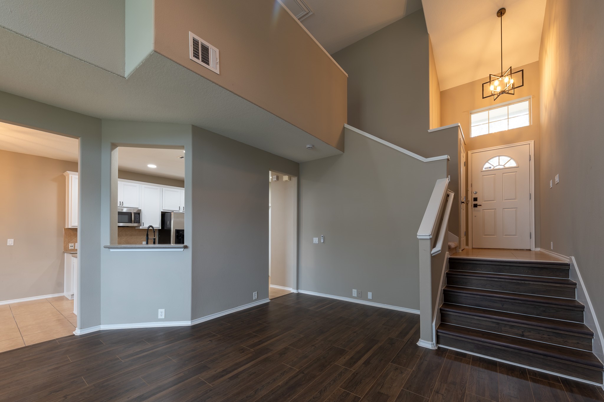 13600 Breton Ridge Street, Unit 35C Houston, TX 77070 - Photo 8 of 35 a view of a hallway with wooden floor and staircase