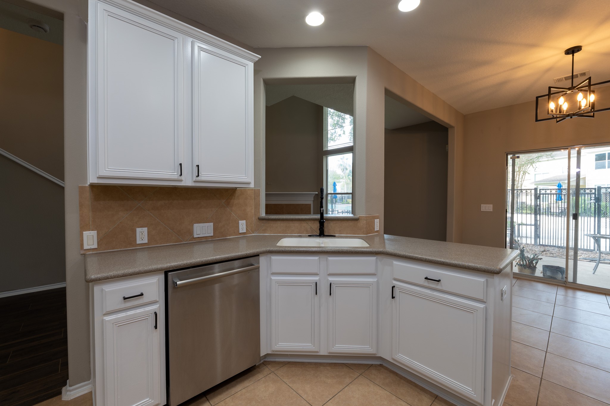 13600 Breton Ridge Street, Unit 35C Houston, TX 77070 - Photo 9 of 35 a kitchen with white cabinets and sink