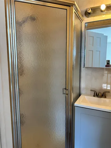 a bathroom with a sink and mirror