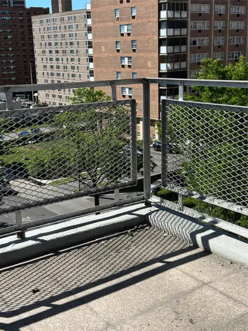 a view of a balcony with a bench