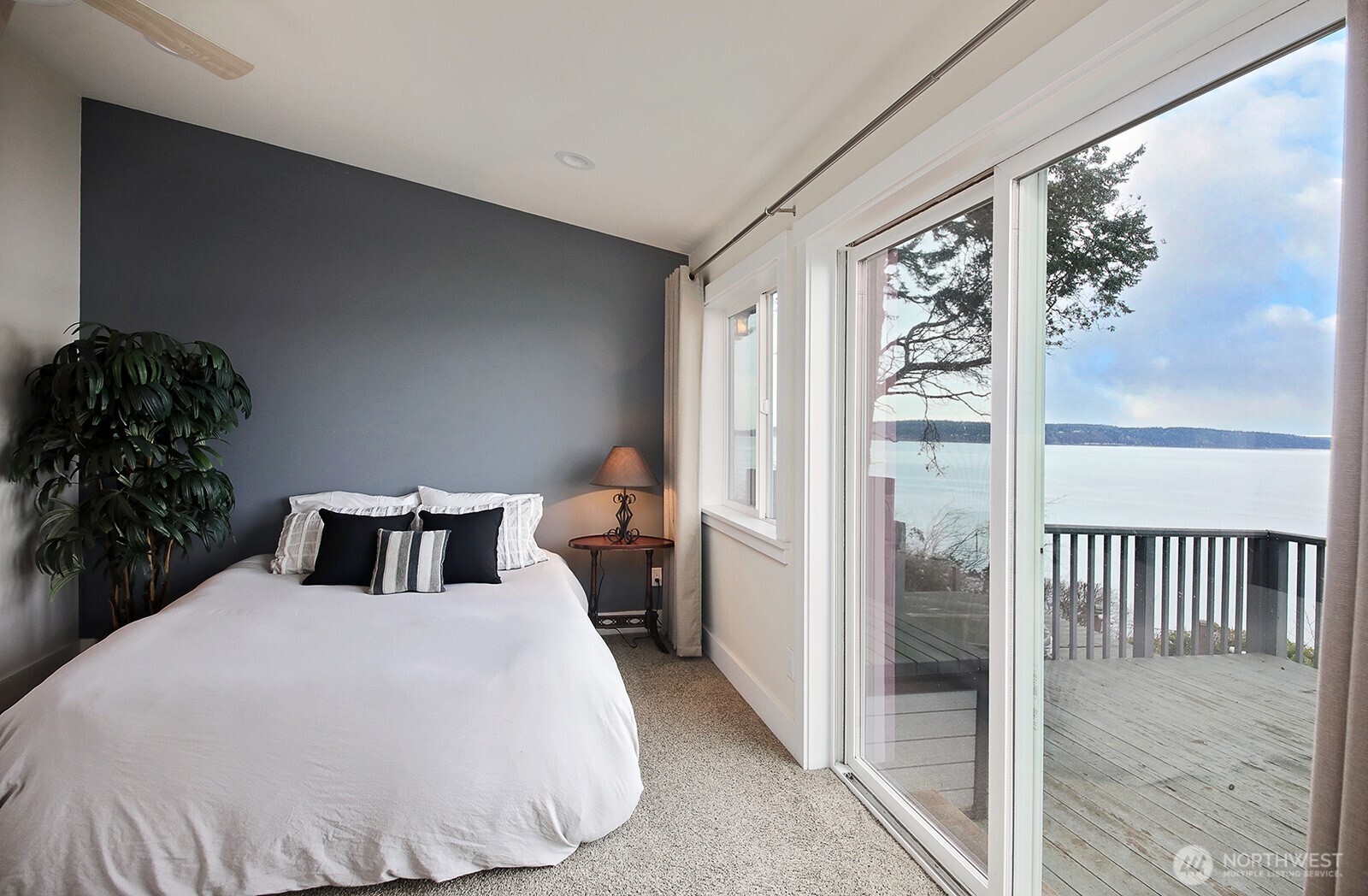 2999 Saratoga Road Langley, WA 98260 - Photo 17 of 40 a bedroom with a bed and a window