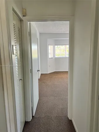 an empty room with a fan