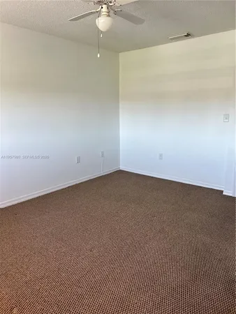 an empty room with a bathroom