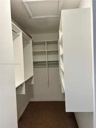 a bathroom with a double vanity sink and mirror
