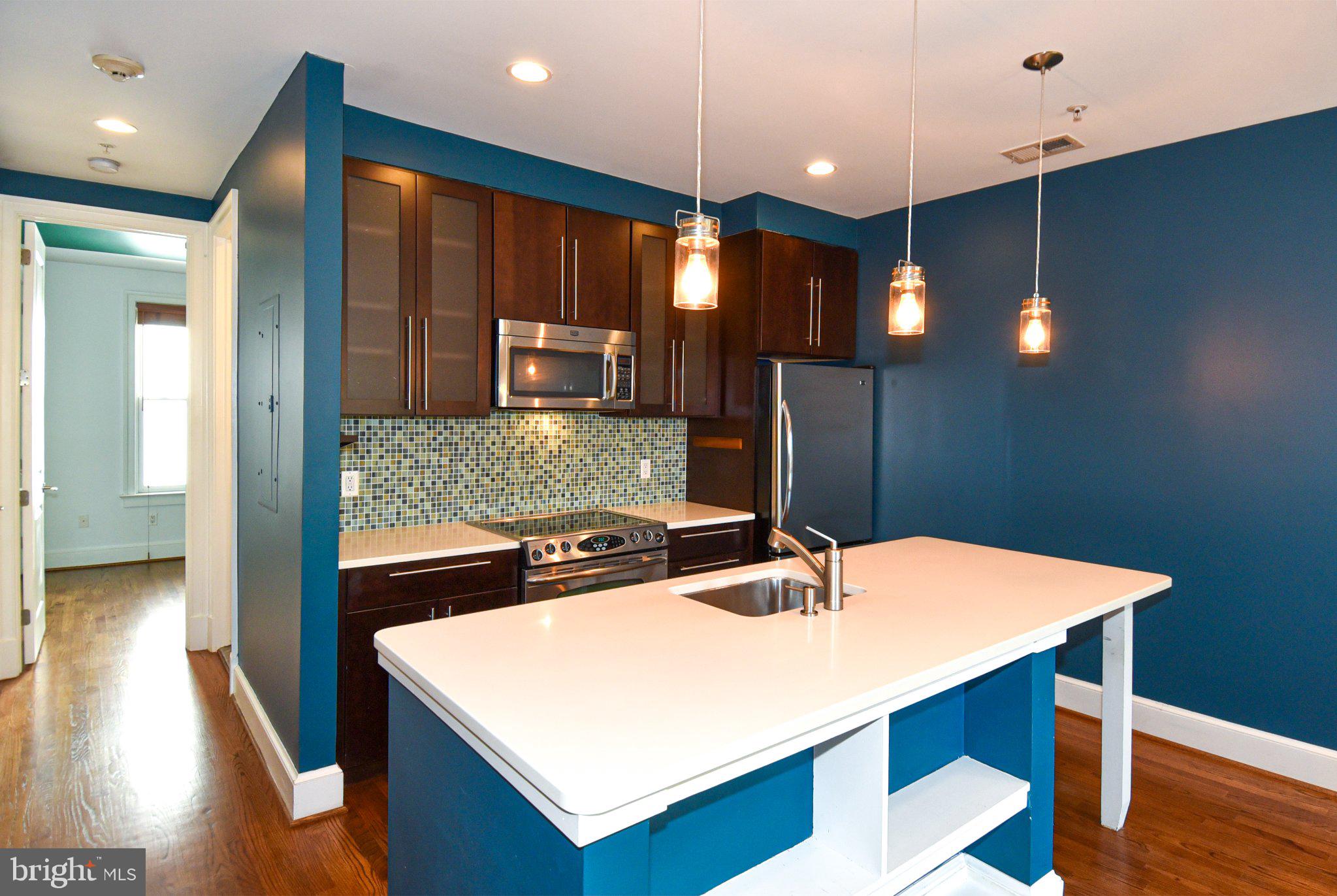 1316 9th Street Northwest Washington, DC 20001 - Photo 22 of 44 Modern kitchen with vibrant accents.