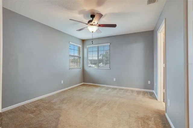 a bathroom with a granite countertop sink mirror and bathtub