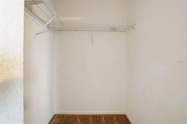 a bathroom with a sink double vanity granite tub and a mirror