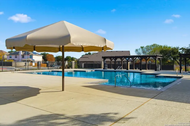 a view of a patio with a table and chairs