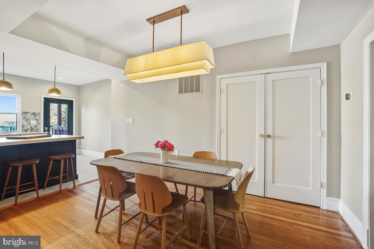 417 Emerson Street Northwest Washington, DC 20011 - Photo 15 of 47 a view of a dining room with furniture and wooden floor