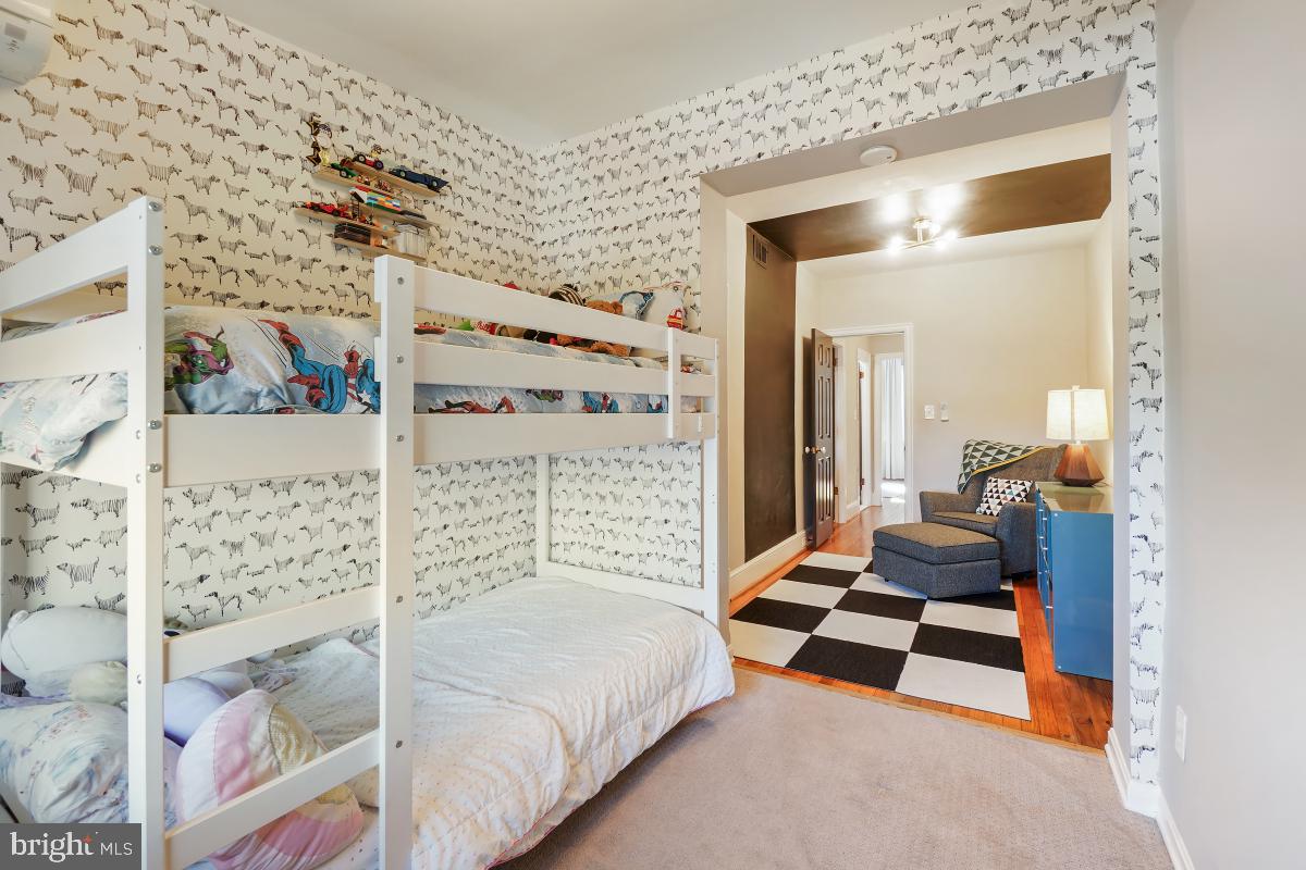 417 Emerson Street Northwest Washington, DC 20011 - Photo 29 of 47 a bedroom with a bed and a window