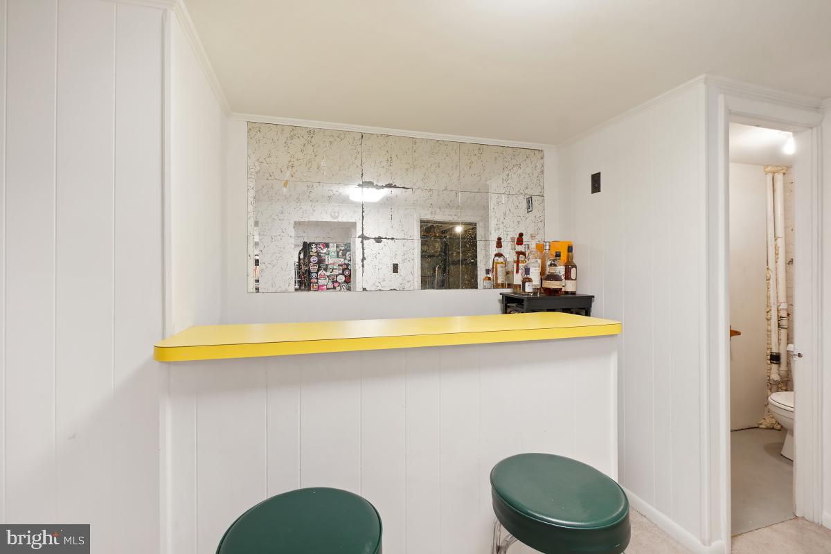 417 Emerson Street Northwest Washington, DC 20011 - Photo 36 of 47 a bathroom with a sink a toilet and a mirror