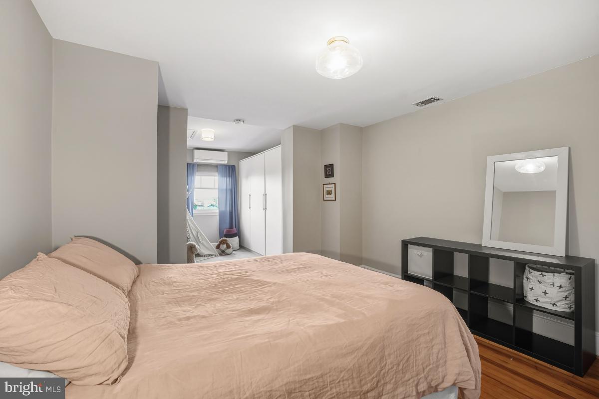 417 Emerson Street Northwest Washington, DC 20011 - Photo 37 of 47 a large white bed in a white room