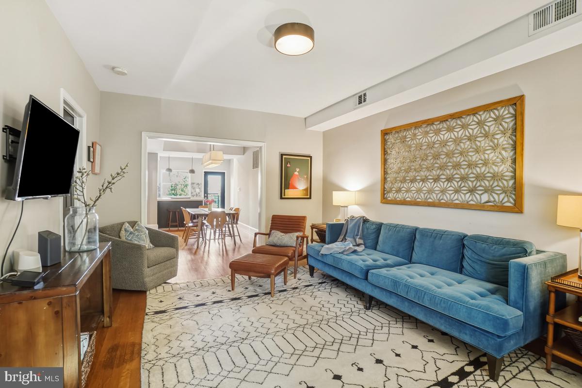 417 Emerson Street Northwest Washington, DC 20011 - Photo 7 of 47 a living room with furniture and a flat screen tv
