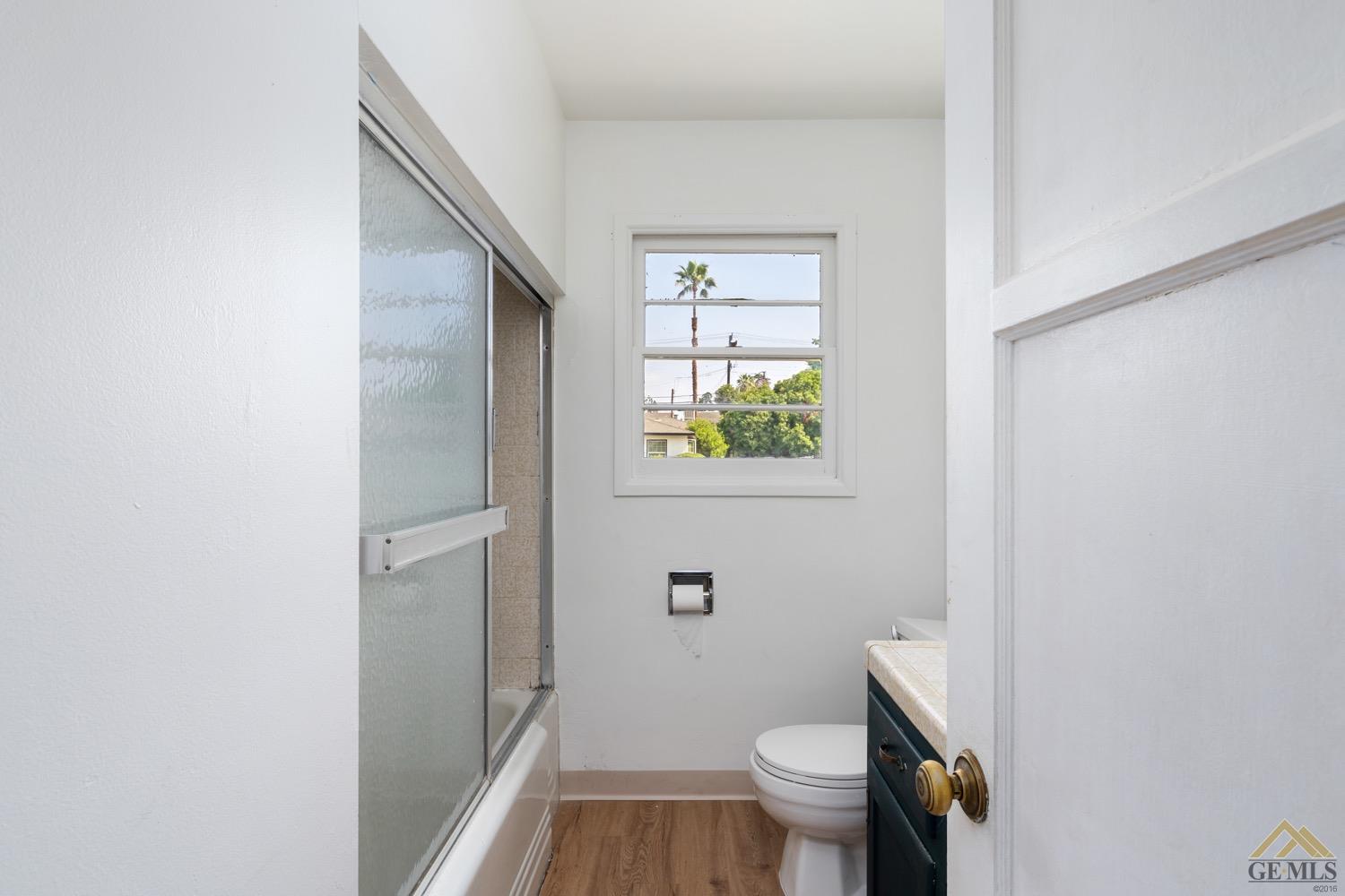 Undisclosed Address Bakersfield, CA 93301 - Photo 13 of 21 a bathroom with a toilet and a shower