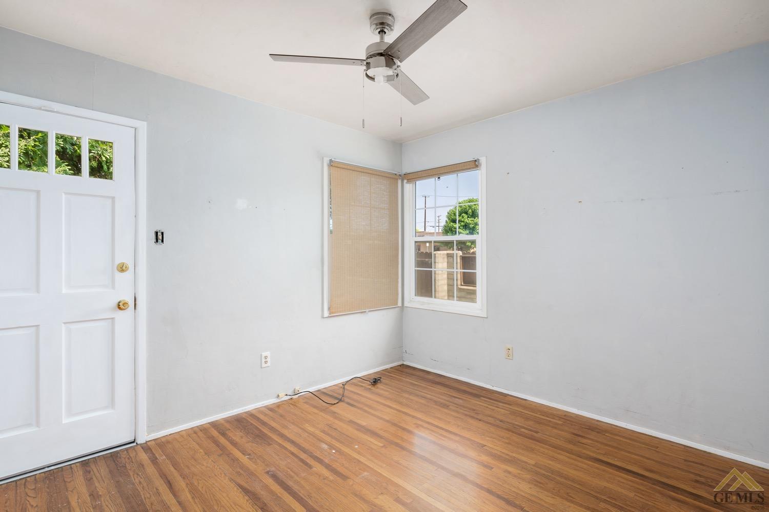 Undisclosed Address Bakersfield, CA 93301 - Photo 15 of 21 an empty room with windows and fan
