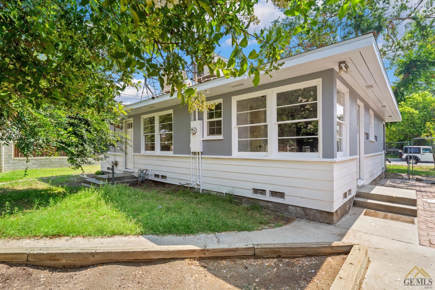 Undisclosed Address Bakersfield, CA 93301 - Photo 18 of 21 front view of a house with a yard