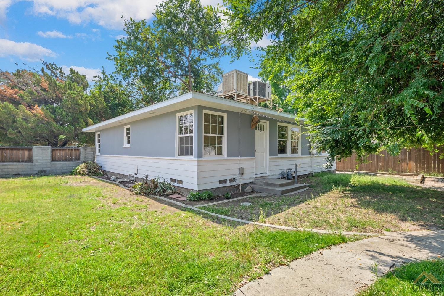 Undisclosed Address Bakersfield, CA 93301 - Photo 19 of 21 a front view of a house with garden