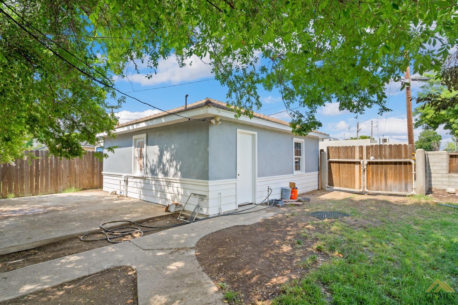 Undisclosed Address Bakersfield, CA 93301 - Photo 20 of 21 a house with yard in front of it