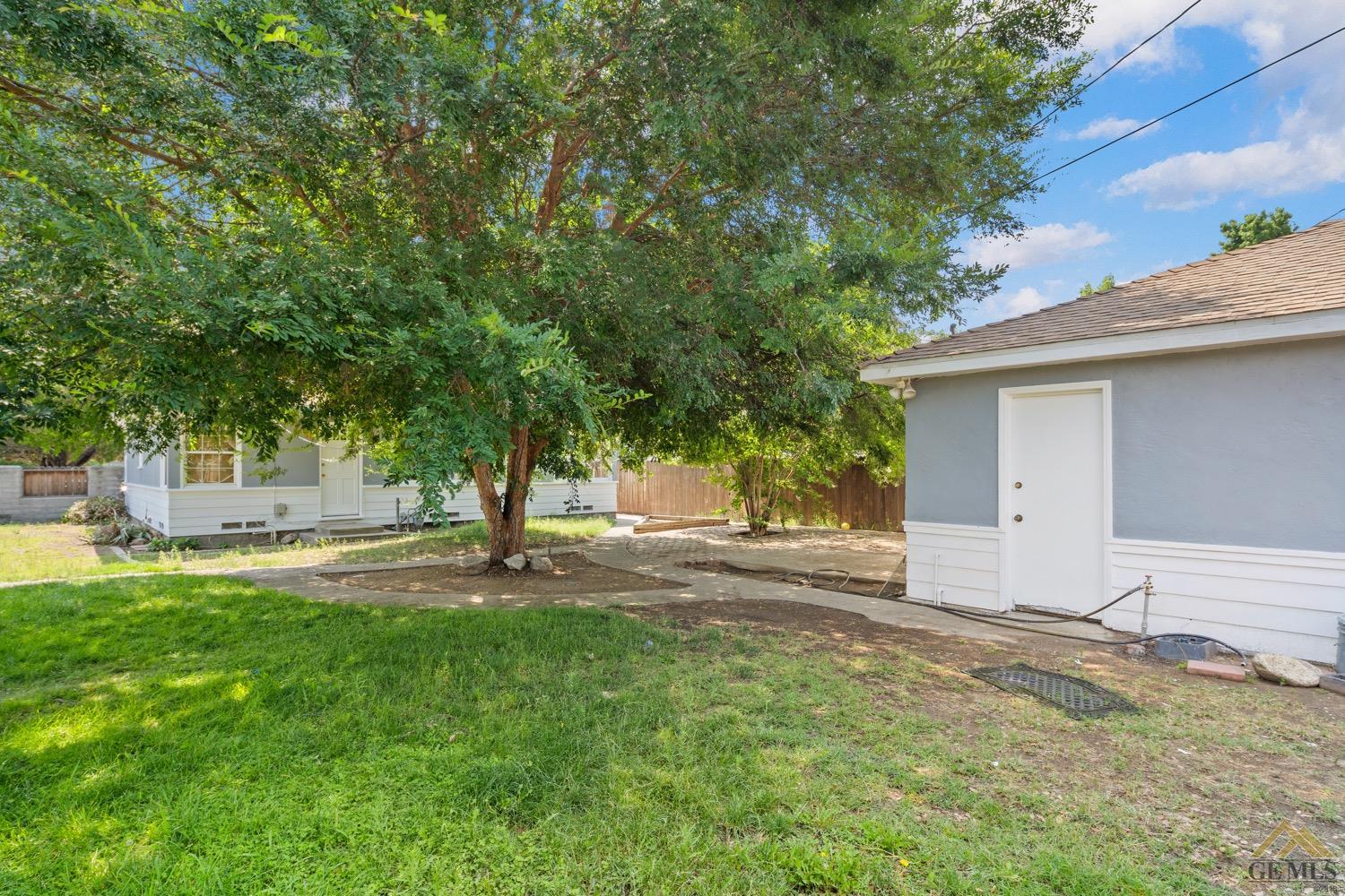 Undisclosed Address Bakersfield, CA 93301 - Photo 21 of 21 a backyard of a house with table and chairs