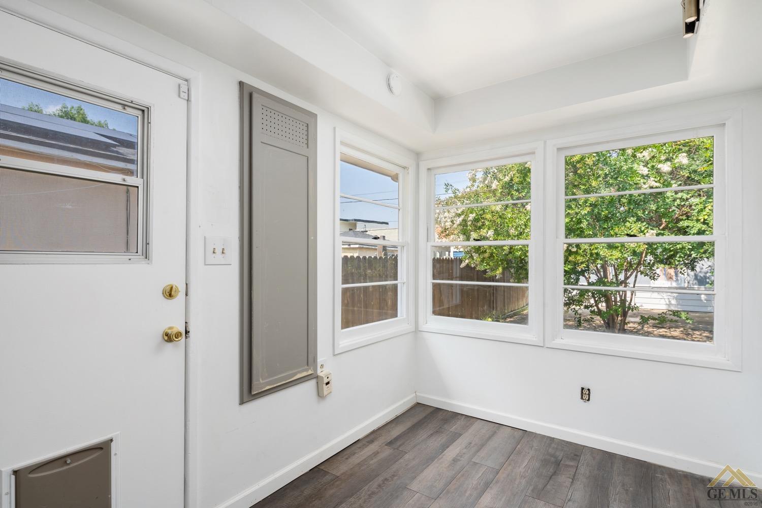 Undisclosed Address Bakersfield, CA 93301 - Photo 9 of 21 a view of empty room with wooden floor and fan