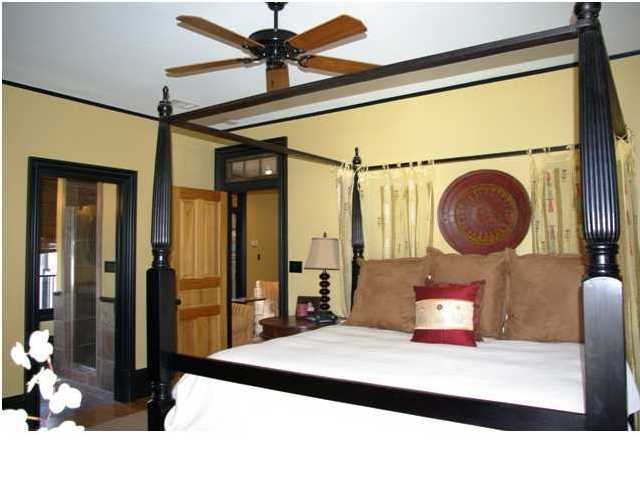 54 Atticus Road Rosemary Beach, FL 32461 - Photo 8 of 19 a bedroom with a bed a mirror and windows