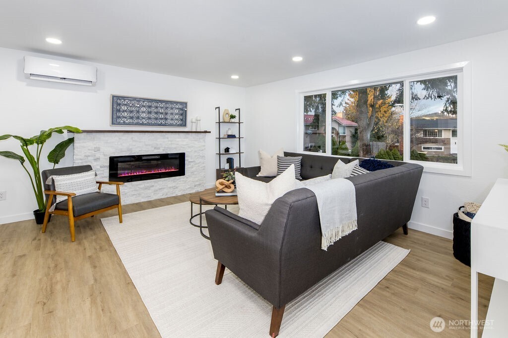 1101 Vashon Court Northeast Renton, WA 98059 - Photo 4 of 30 a bed room with furniture and a fireplace