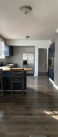 a bathroom with a sink vanity mirror and toilet