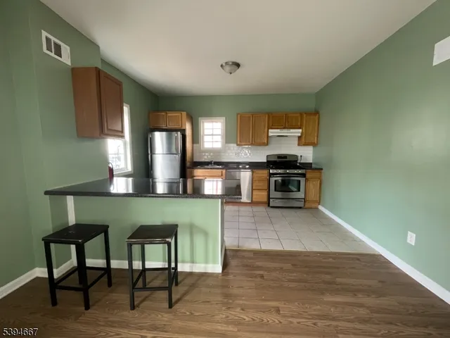 a kitchen with a table and chairs in it