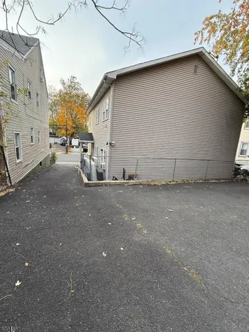 a view of a house with a street
