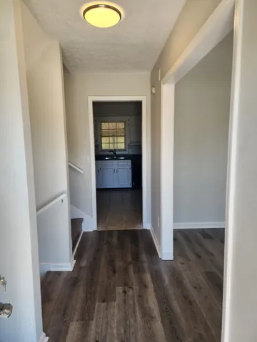 a view of a bedroom from a hallway