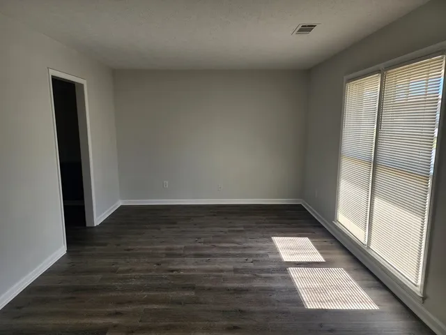 a view of an empty room and window