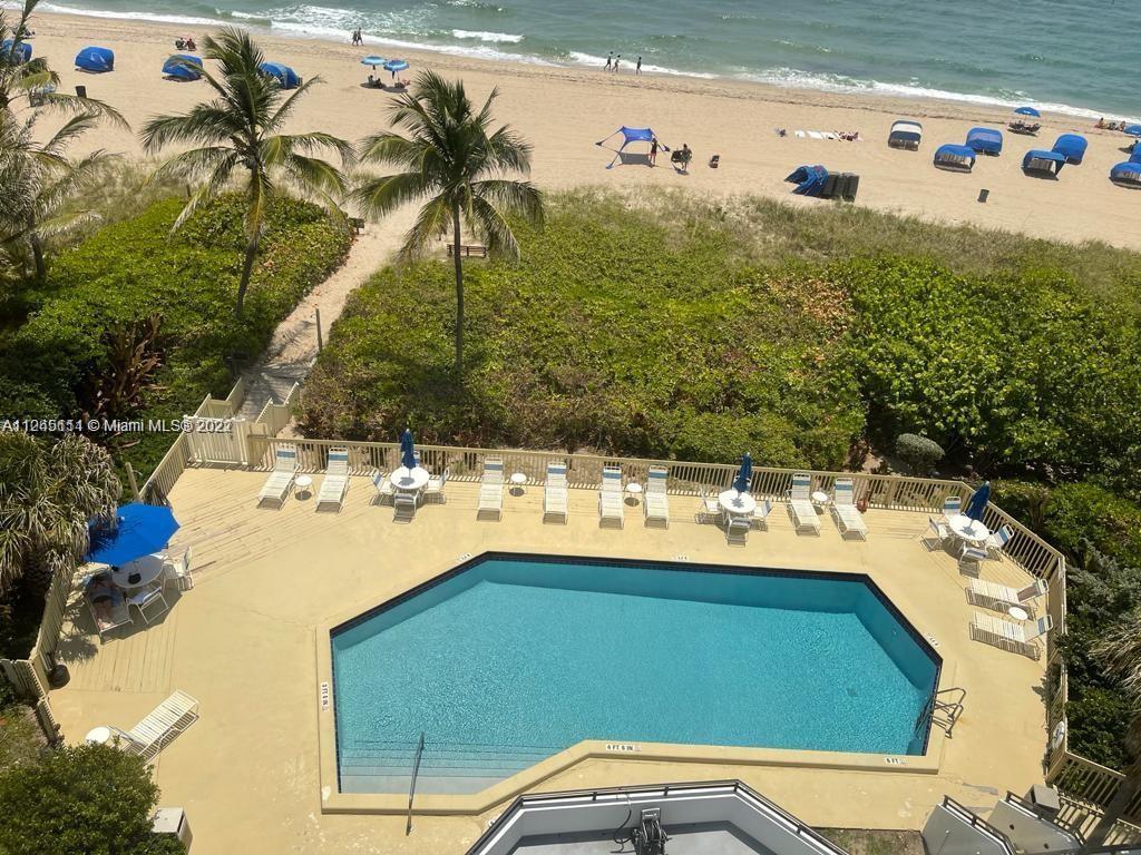 Beach Pompano Beach, FL 33062 - Photo 3 of 17 a view of a swimming pool with a yard