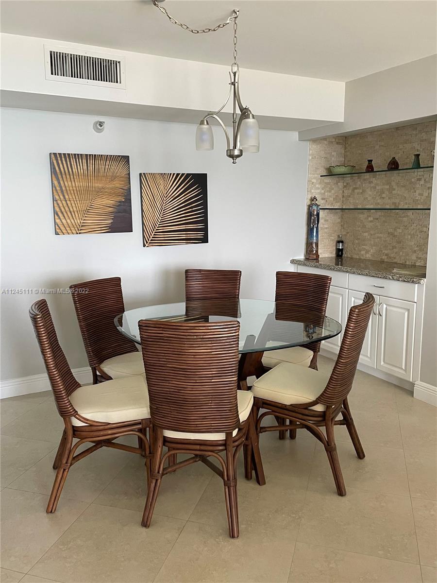 Beach Pompano Beach, FL 33062 - Photo 7 of 17 a dining room with furniture and window