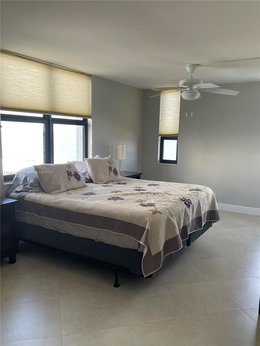 Beach Pompano Beach, FL 33062 - Photo 8 of 17 a bedroom with a bed dresser and a window