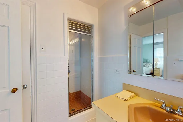 a bathroom with a tub and shower