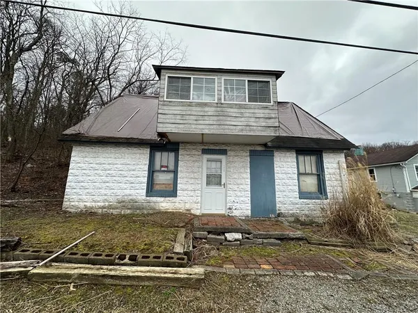 a front view of a house with yard