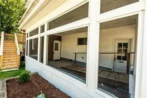 a front view of a house with a glass door