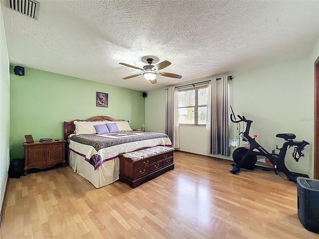 4289 Castle Avenue Spring Hill, FL 34609 - Photo 16 of 50 a bedroom with a bed and a window