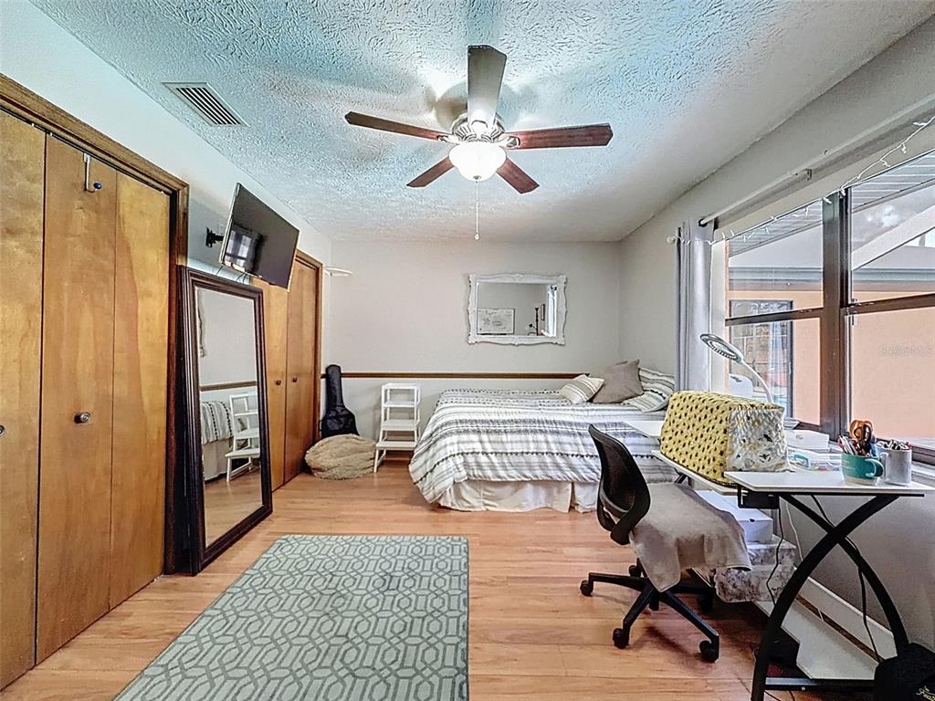 4289 Castle Avenue Spring Hill, FL 34609 - Photo 20 of 50 a bedroom with furniture and a window