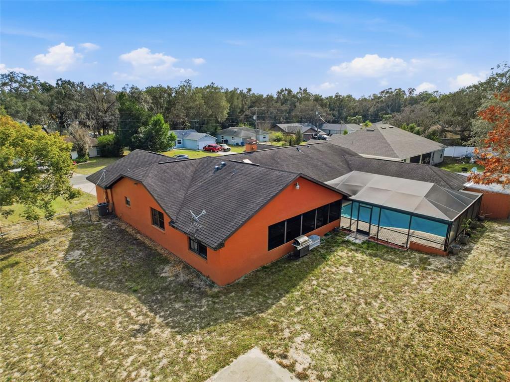 4289 Castle Avenue Spring Hill, FL 34609 - Photo 3 of 50 an aerial view of a house with swimming pool and mountains