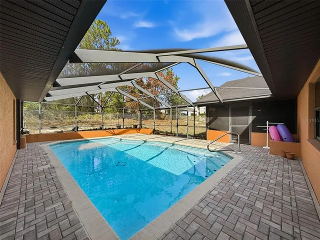 a view of a swimming pool with a patio