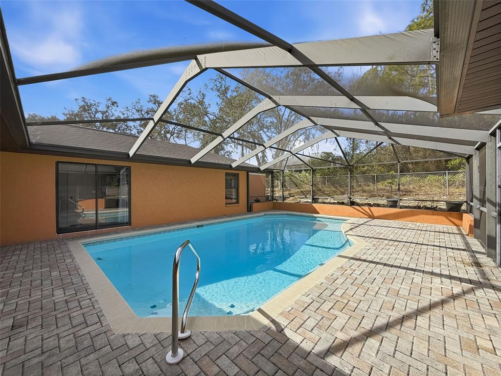 4289 Castle Avenue Spring Hill, FL 34609 - Photo 34 of 50 a view of a chairs and table in the patio