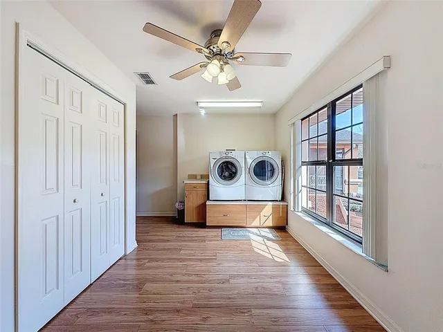 a view of an entryway with wooden floor