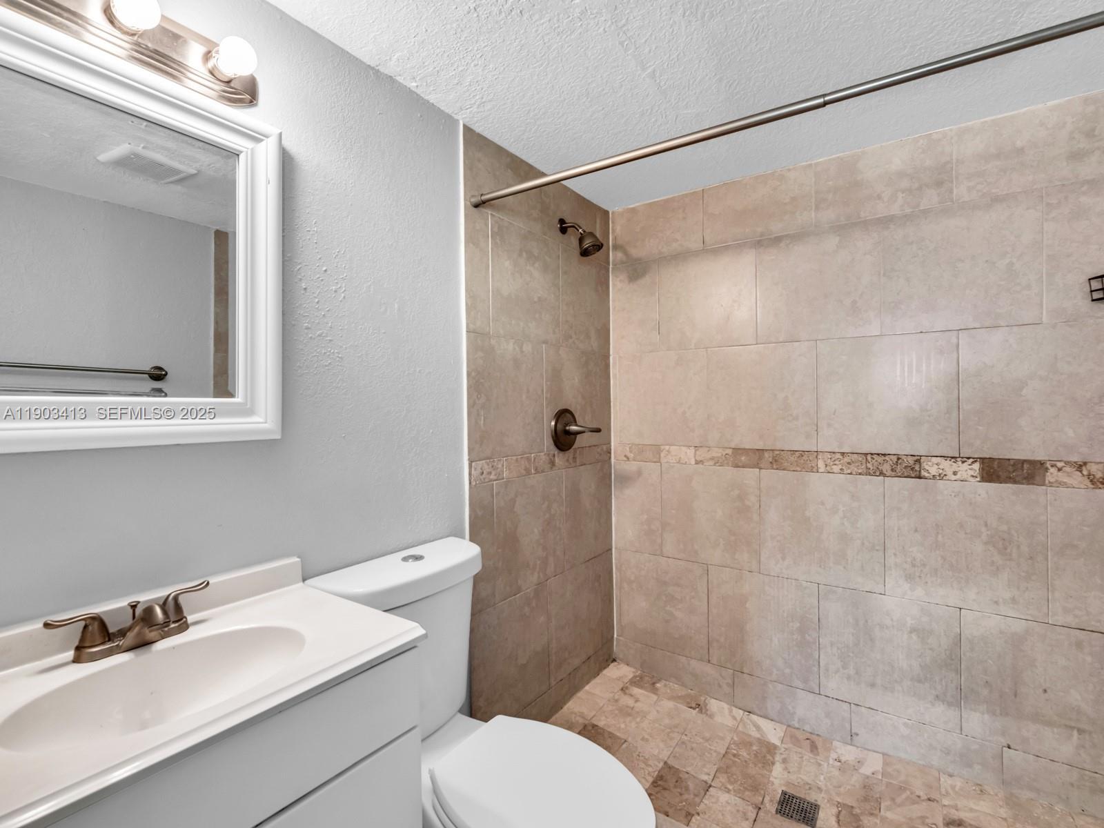 6238 Southwest 24th Street Miramar, FL 33023 - Photo 15 of 33 a bathroom with a sink a toilet and shower