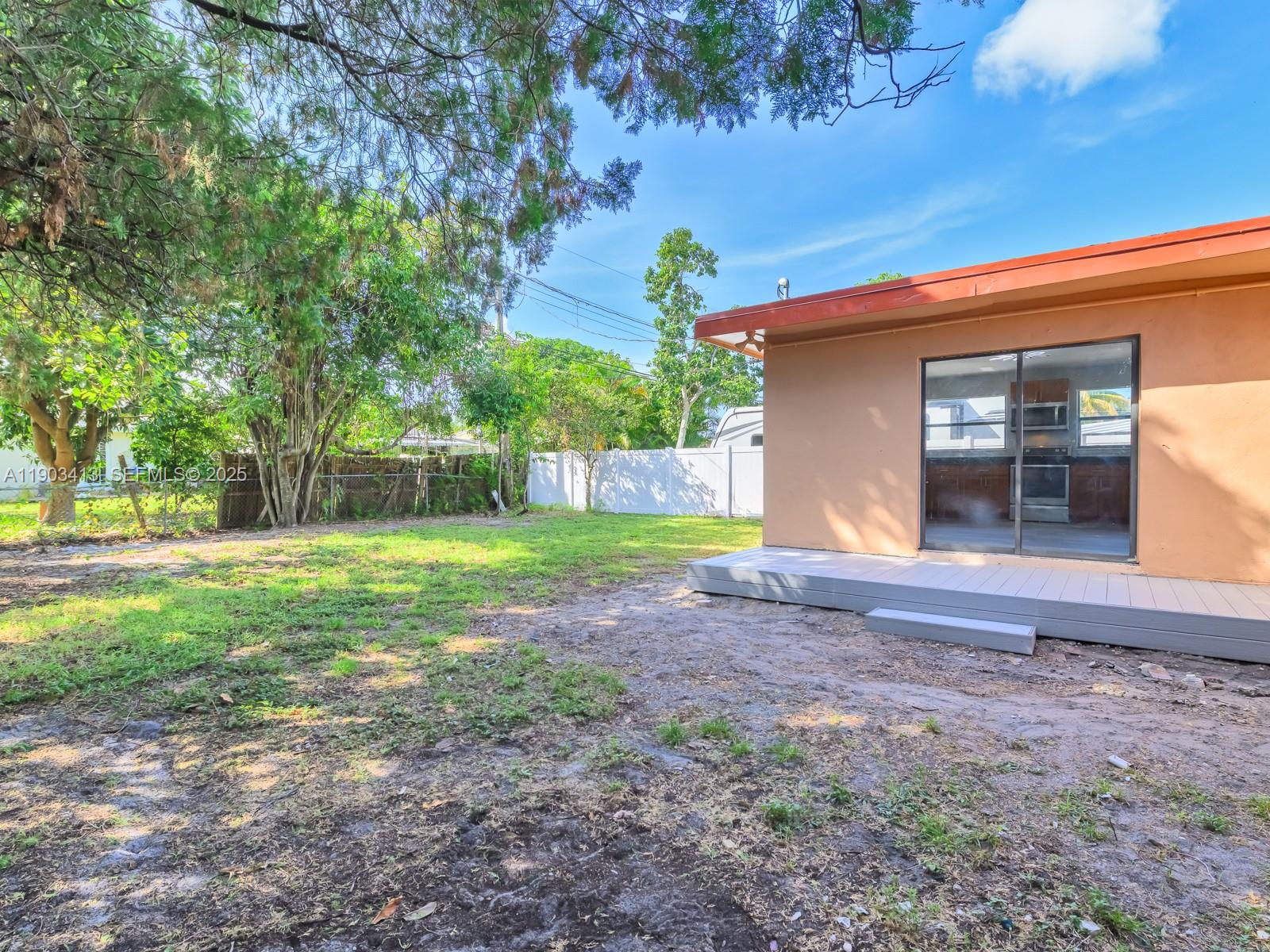 6238 Southwest 24th Street Miramar, FL 33023 - Photo 21 of 33 a view of a house with yard and tree s