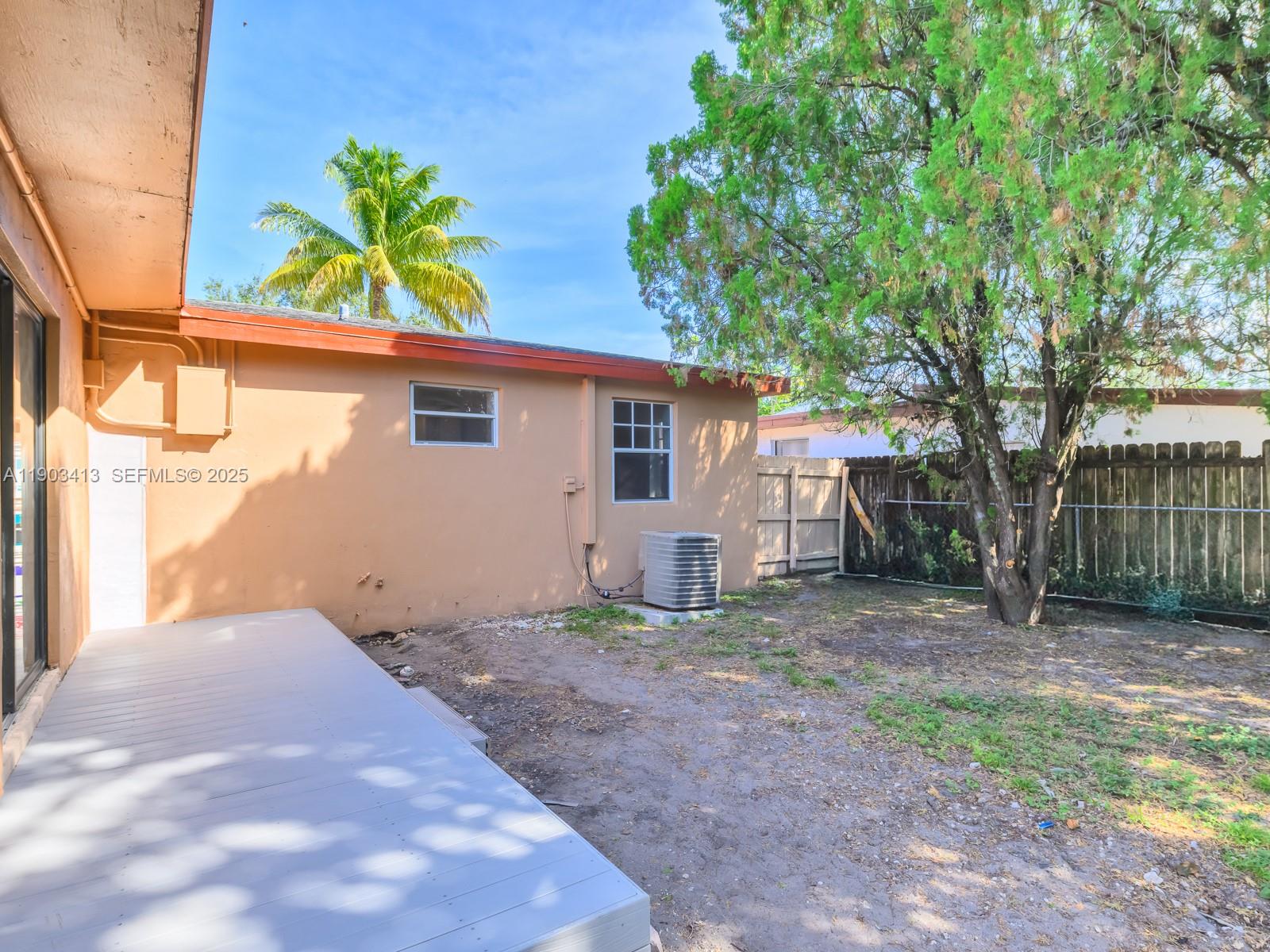 6238 Southwest 24th Street Miramar, FL 33023 - Photo 22 of 33 a front view of a house with a yard and garage